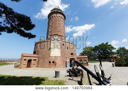 KOLOBRZEG POLAND - JUNE 22 2016: Massive building of the lighthouse with its 26 meters high is one of the most recognizable tourist attractions in the city