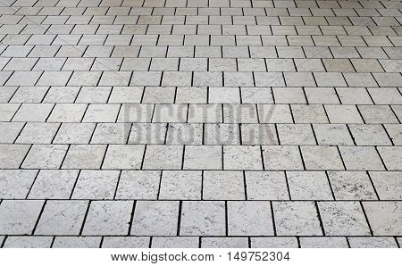 Gray stone floor tile as a texture.