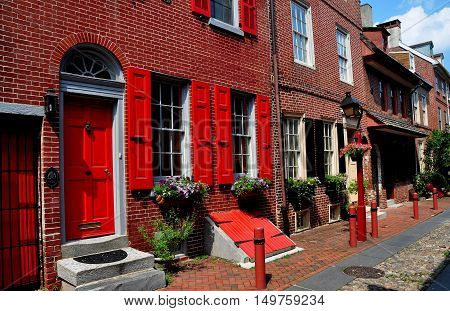 Philadelphia Pennsylvania - June 25 2013: Finely preserved colonial brick houses dating from 1703-1736 line historic Elfreth's Alley