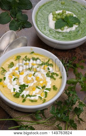 two bowl of puree soup mealies and pea with herbs