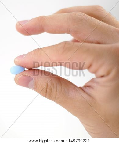 Male Hand With Blue Pills