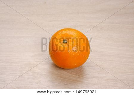 Fresh Orange fruit on a wooden background