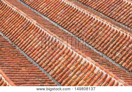 Orange old roof tiles close up background
