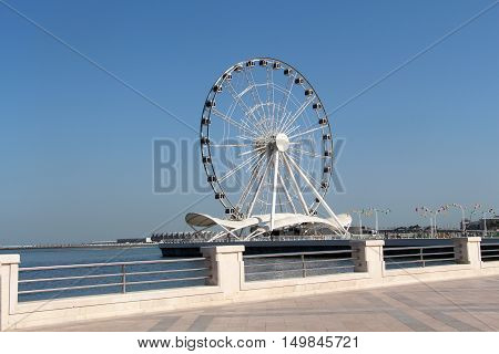 Attraction. Ferris wheel. Seafront in Baku Azerbaijan.