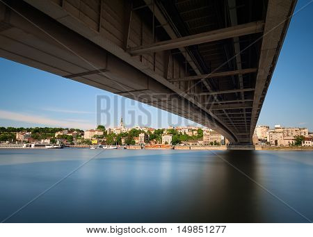 Idyllic view on the old part of the city and part of the port of Belgrade town under the Branko bridge. Long exposure shot.