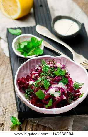 Beet salad with tahina sauce .selective focus