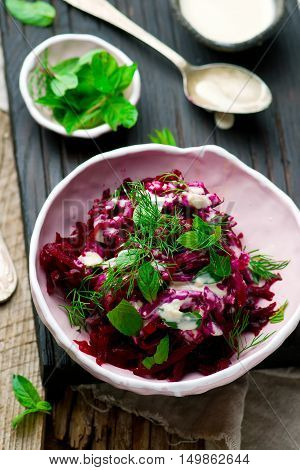 Beet salad with tahina sauce .selective focus
