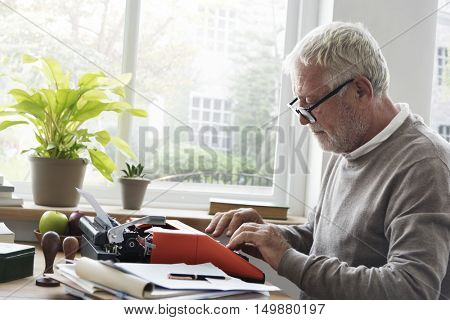 Senior Adult Typing Typerwriter Concept