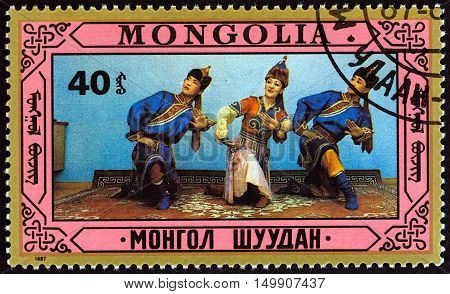 MONGOLIA - CIRCA 1987: A stamp printed in Mongolia shows traditional dance, circa 1987.