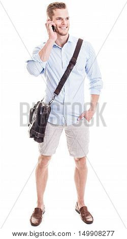 Talking On The Phone - Full Length Portrait Of A Young Man Standing In Front Of White Background And