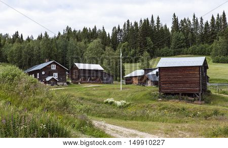HARJEDALEN, SWEDEN ON JULY 07. View of an old wooden homestead on July 07, 2016 in Harjedalen, Sweden. Rural place in the landscape, countryside. Editorial use.