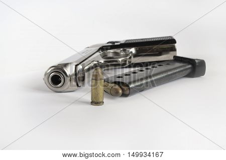 Pistol and ammunition on the white background.
