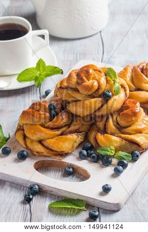 Homemade pumpkin cinnamon yeasted buns, fall baking concept