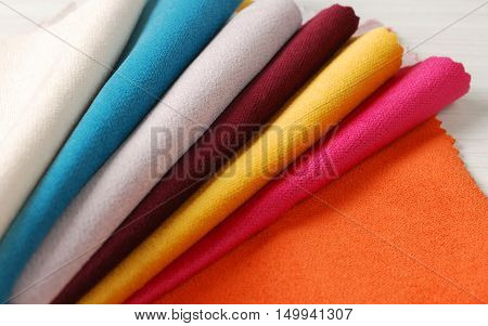 Bright collection of colorful velour textile samples. Fabric texture background