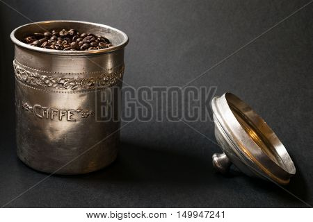 Coffee beans pot in a dark background