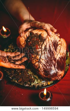 a witch holds a ritual at the heart of a bull