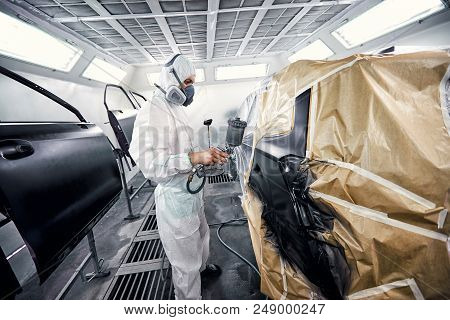 Restoration Painting Of A Black Car In The Service Center.