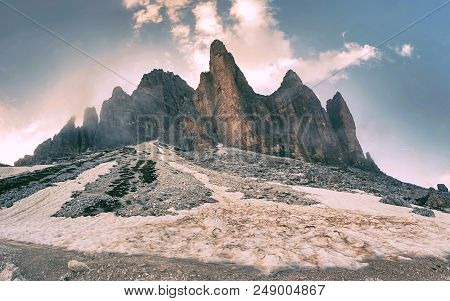 Tre Cime Di Lavaredo Rocks  Hidden In Gentle Fog. Early Summer Trip In Dolomites In Italy.