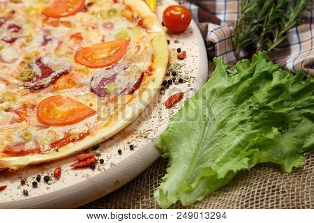 Pizza With Tomato, Cheese, Smoked Sausage, Boiled Sausage, Pepper Spices On A Wooden Tray Close-up