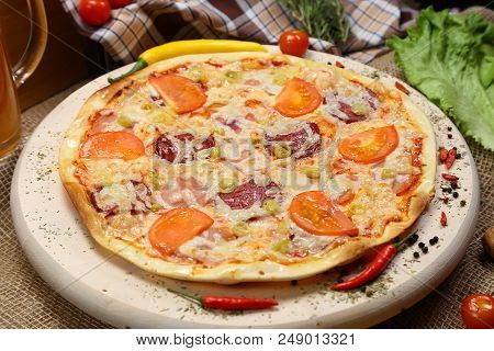 Pizza With Tomato, Cheese, Smoked Sausage, Boiled Sausage, Pepper Spices On A Wooden Tray Close-up