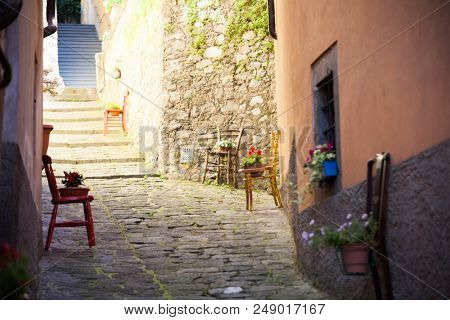 Narrow street in the medieval town of Barga in Tuscany, Italy