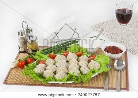 Kinkali In Green With Tomatoes And Onions. Serve With Soy Sauce And Sour Cream.