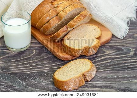 Still Life With Slices Of Bread On A Wooden Background