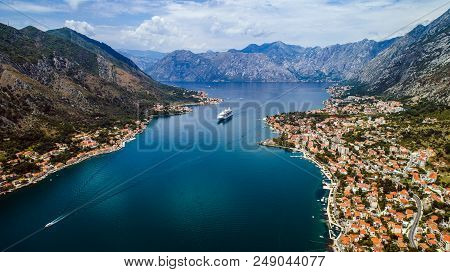 Aerial Beautiful View Of Kotor Bay. Cruise Ship Docked In Beautiful Summer Day. View Of Kotor Old To