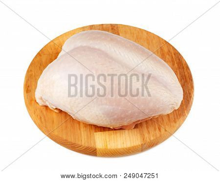 Raw Chicken Breast On The Wooden Board Isolated On White Background.