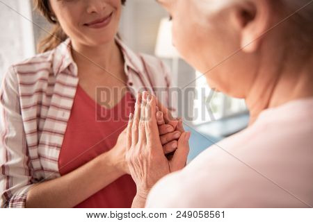 Aged Mother. Beautiful Woman Wearing Nice Striped Shirt Feeling Tenderness While Speaking To Her Age
