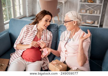 Future Grandmother. Caring Future Grandmother Wearing Nice Black Glasses Making Nice Unforgettable P