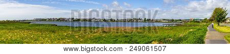 Lough Atalia Bay With Houses In Background
