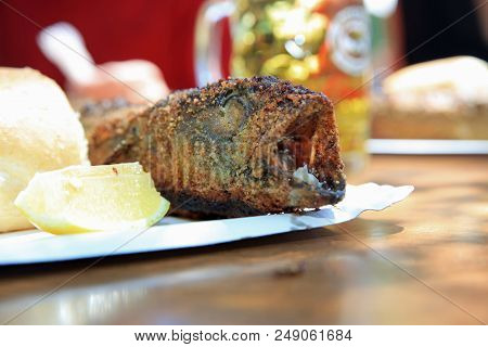 Fresh Mackerel On Stick At Barbecue Party. Germany