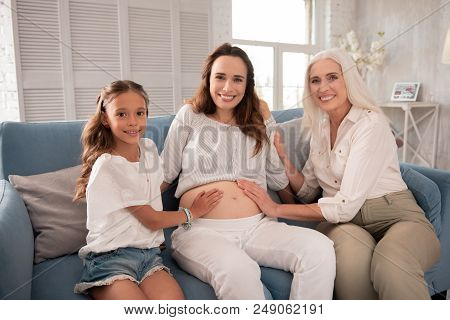 Family Time. Blonde-haired Smiling Grandmother Coming To Her Family House While Spending Unforgettab