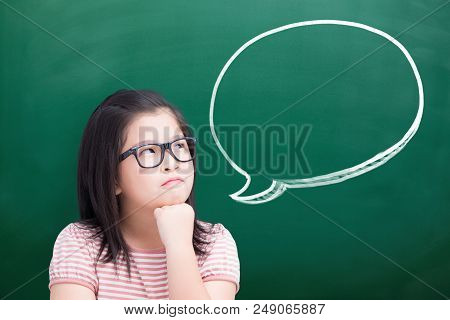 Unhappy Girl Think Something With Speech Bubble On Green Chalkboard