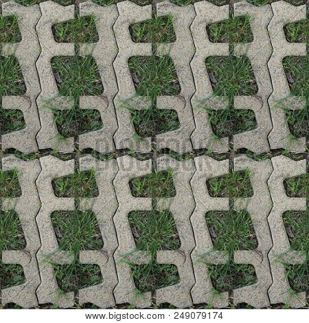 Seamles Pattern Of Concrete Road Tile On The Green Grass Path
