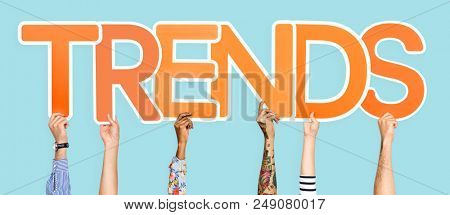 Diverse hands holding the word trends