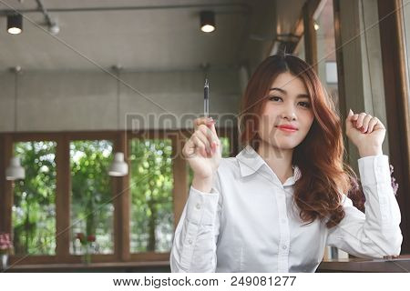 Prettyface Of Young Asian Business Woman Looking Camera And Have An Idea At Living Room With Copy Sp