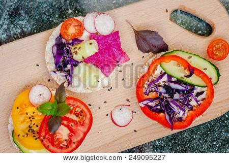 Open Sandwiches Of Rice Cakes With Cream Cheese , Vegetables, Healthy Breakfast