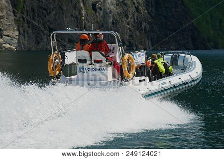 Flam, Norway - June 08,2012: Unidentified Tourists Enjoy The Safari Tour By Speed Boat At The Aurlan