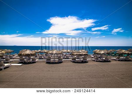 Permissa black sand beach in Santorini. Greece. 