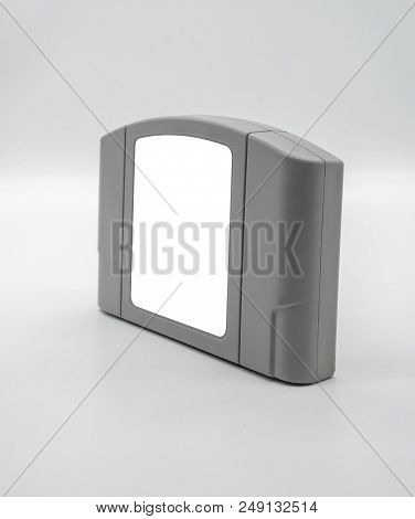 Tv Game Cartridge In Grey Plastic Case From 90s Isolated On White Background