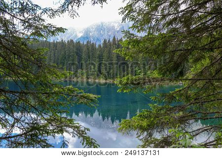 Lake Carezza With Reflection Of Mountains In The Dolomites
