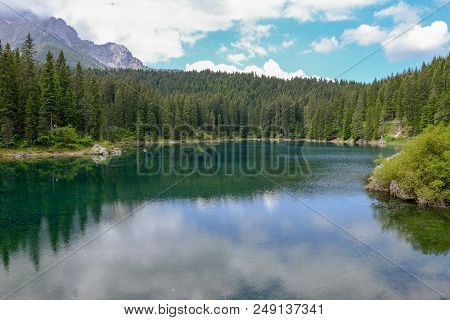 Lake Carezza With Reflection Of Mountains In The Dolomites