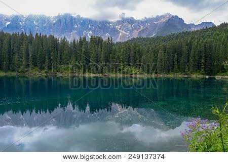 Lake Carezza With Reflection Of Mountains In The Dolomites