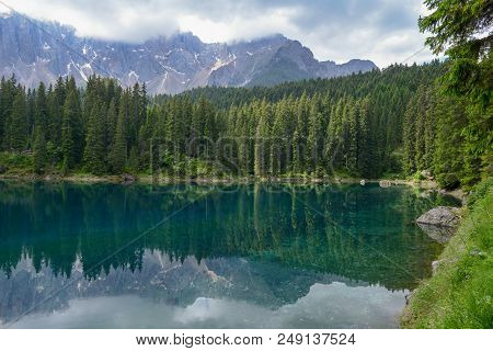 Lake Carezza With Reflection Of Mountains In The Dolomites