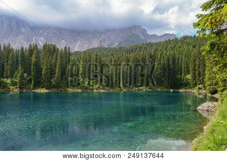 Lake Carezza With Reflection Of Mountains In The Dolomites
