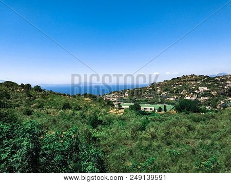 View Of The Roofs Of The Houses, The Sea And The Mountains In The Bay