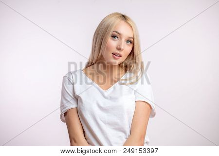 A Toothsome Blonde In Comfortable White T-shirt