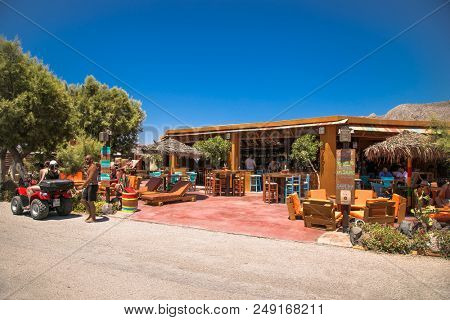  Santorini, Greece- Jun 11, 2016. Caffe at Permissa black sand beach in Santorini. Greece. 

